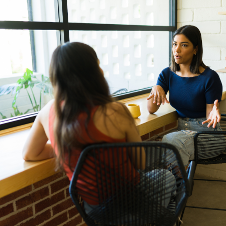 two people talking at work